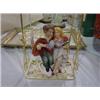 Image 1 : PORCELAIN COUPLE ON SWING