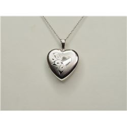 STERLING SILVER HEART LOCKET. REPLACEMENT VALUE: $60.00