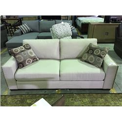 BEIGE UPHOLSTERED STUDDED EDGE CONTEMPORARY SOFA WITH 2 THROW CUSHIONS