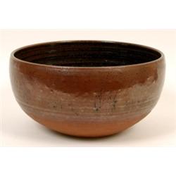 A Michael Cardew Pottery Bowl, the interior with speckled black and brown glaze, Winchcombe impre...