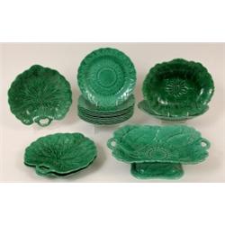 A late 19th Century Wedgwood Green Majolica Harlequin Dessert Service, decorated flowers and leav...
