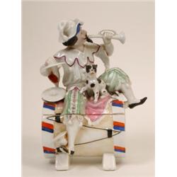 A Late 19th Century Continental Porcelain Tobacco Jar and Cover, in the form of a musician and hi...