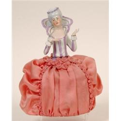 A Porcelain Half Doll, in the form of an 18th century lady, (fingers chipped) 18 cm See illustrat...