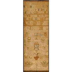 An Early 19th Century Sampler, with alphabet, flowers and deer, 39 x 14 cm  See illustration £30...