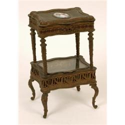 An Early 20th Century Miniature Gilt Metal Etagere, with two lidded jewellery compartments and a...