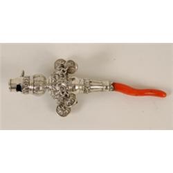 A Victorian Silver Baby's Rattle, the whistle end above four bells (two missing) with a coral tee...