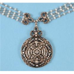 A late 19th Century Diamond Pendant, on a four strand seed pearl necklace interspaced with diamon...