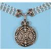 Image 1 : A late 19th Century Diamond Pendant, on a four strand seed pearl necklace interspaced with diamon...