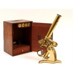 A Victorian Brass Microscope, in a mahogany case £60 - 100...