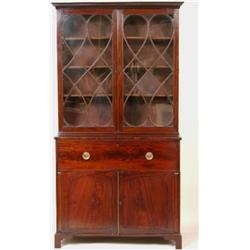 A George III Mahogany Secretaire Bookcase, the dentil moulded cornice above a pair of glazed door...
