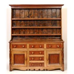 A Victorian North Country Dresser, the stepped cornice above three shelves, the base with four sh...