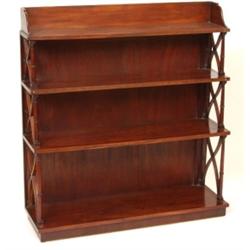 A Regency Style Mahogany Waterfall Bookcase, with four graduated shelves and turned supports, on...