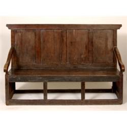 An 18th Century Elm and Pine Settle, the panel back above pine plank seats, 166 cm  See illustrat...