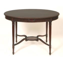 A Late 18th Century Style Mahogany Oval Centre Table, with reeded tapering legs, 104 cm  See illu...