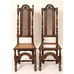 A Pair of Early 18th Century oak Chairs, the carved crest rail above caned backs and seats, with...