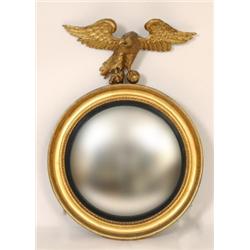 A 19th Century Gilt Framed Convex Wall Mirror, with carved wood eagle surmount, 100 x 71 cm  See...