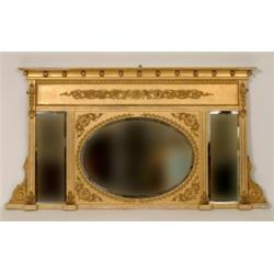 A Regency Gilt Framed Mirror, the cornice with applied gilt ball, above a griffin and foliate scr...