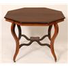 Image 1 : A Victorian Inlaid Rosewood Centre Table, the octagonal top, on four cabriole legs, 90 cm  See il...