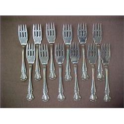 Set of twelve sterling pastry forks, Simmons