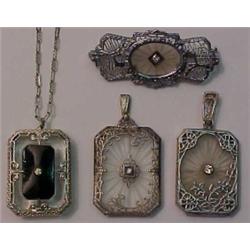 Three crystal and filigree pendants and a pin