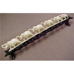 Carved ivory elephant grouping of six single