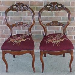 A pair of walnut Victorian side chairs with b