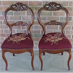 A pair of walnut Victorian side chairs with b