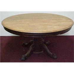 Round oak dining table with carved center ped