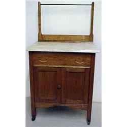 Oak washstand, towel bar over white beveled m