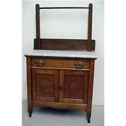 Oak washstand, towel bar over beveled white m