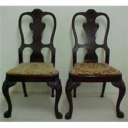 A pair of walnut side chairs by Berkey and Ga