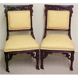 A pair of walnut Victorian side chairs, panel