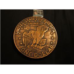 Huge metal Trivet designed in coppertoned Eisenhower Dollar reverse. Three rubber cushioned legs.