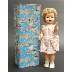 Pedigree walking doll with voice box and moving head, 22 in., in original box. See illustration....