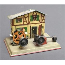 Pre-war German tinplate engineer's chalet steam engine accessory with water wheel and mechanical...