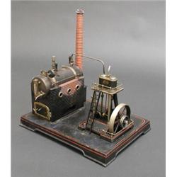 Good early 20th century German stationery steam engine by Doll, with 7 in. boiler twin cylinder e...