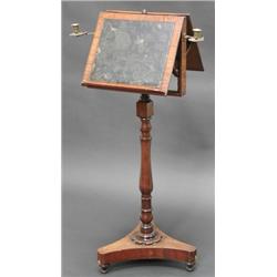 Regency mahogany adjustabale duet music stand with two brass candle brackets, the turned column o...