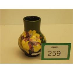 Moorcroft vase decorated with flowers on gree…