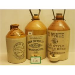 Three stoneware advertising bottles…