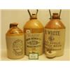 Image 1 : Three stoneware advertising bottles…