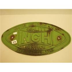Cast iron plaque advertising NCH Service…