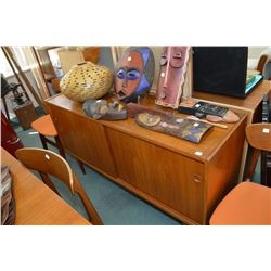 Mid century modern teak sideboard with two sliding doors, one of which exposes two flatware drawers,