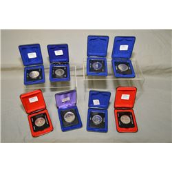 Selection of eight cased Canadian one dollar coins including 1970, 1973 etc.