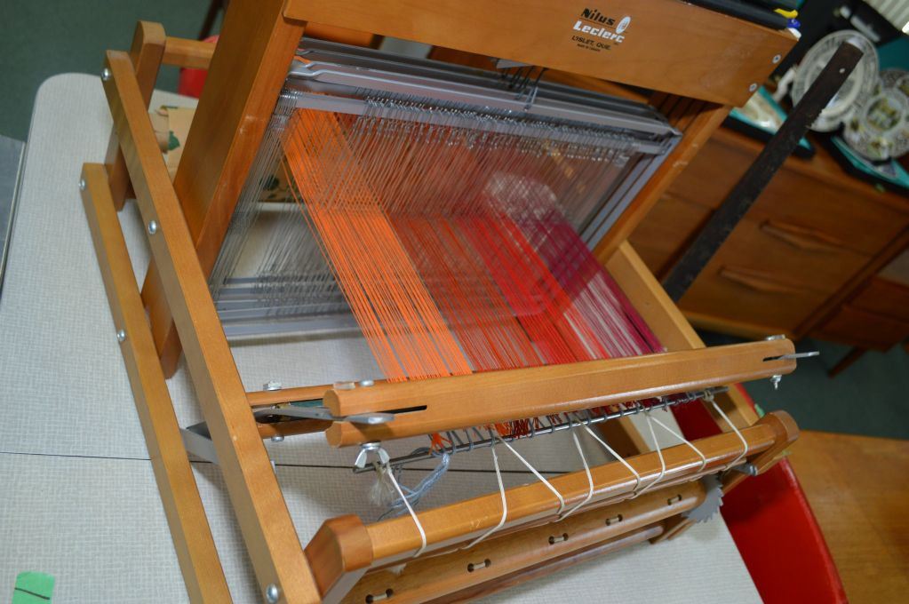 Small Nilus Leclerc weaving loom with 16" weave base and an upright
