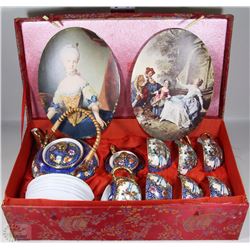 RED DECORATIVE BOX CONTAINING COMPLETE TEA POT