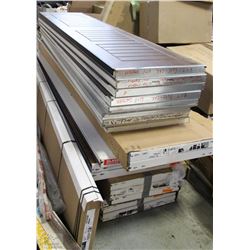 STACK OF ASSORTED GARAGE DOOR PANELS