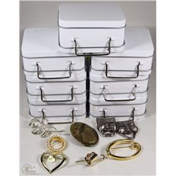 SEVEN SUITCASE JEWELRY BOXES WITH BROOCHES