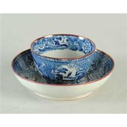 EARLY STAFFORDSHIRE HANDLESS CUP AND SAUCER