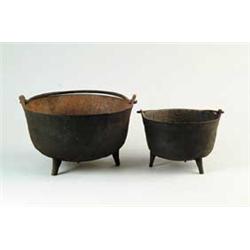 TWO THREE-FOOTED POTS