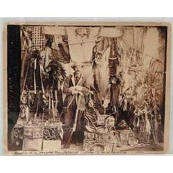 LARGE CABINET PHOTO OF RILEY MILLER WITH “TROPHIES FROM WOUNDED KNEE BATTLEFIELD”
